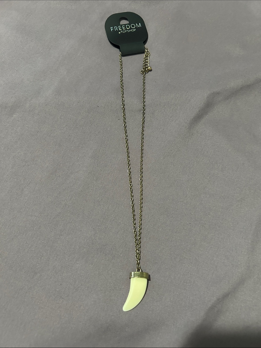 FRIENDS Gold-Tone Chain Necklace with Cream Horn Pendant